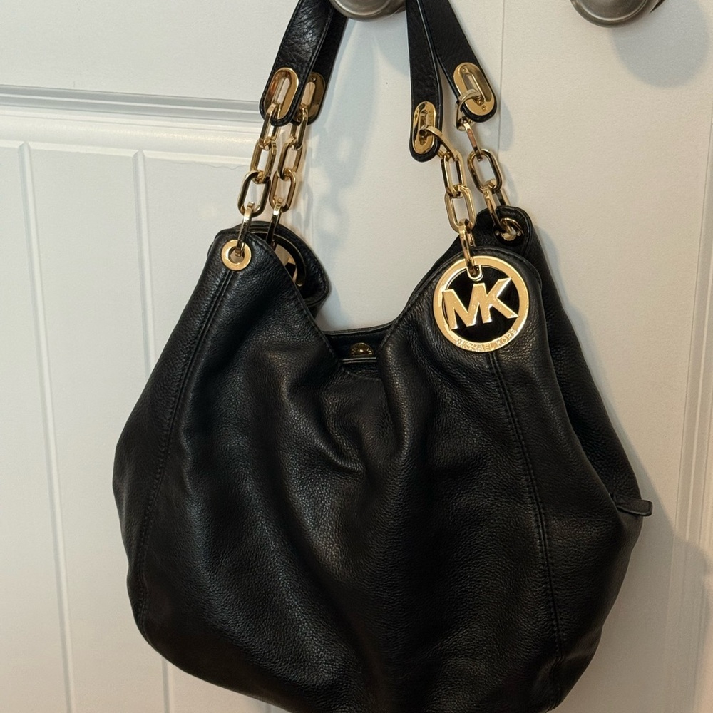 Michael Kors Black Hobo Bag with Gold Accents